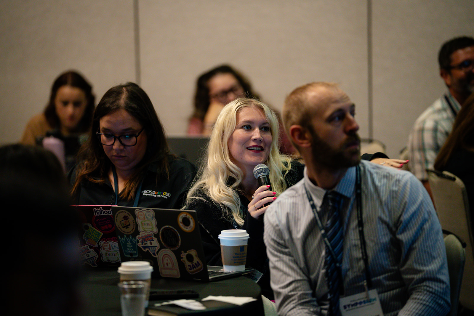 Attendees talking at table