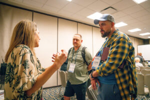 Attendees talking in group excitedly