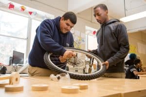 Two High School Boys Disassemble Bike Tire